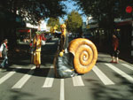 Road safety characters slo and flow use a zebra crossing. 