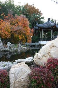 The xie, or pavilion, amongst a pond, rocks, and trees. 